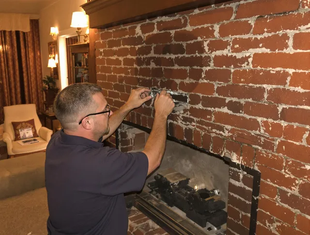 Moreno Valley Chimney Sweep expert fixing a fireplace in Moreno Valley, CA